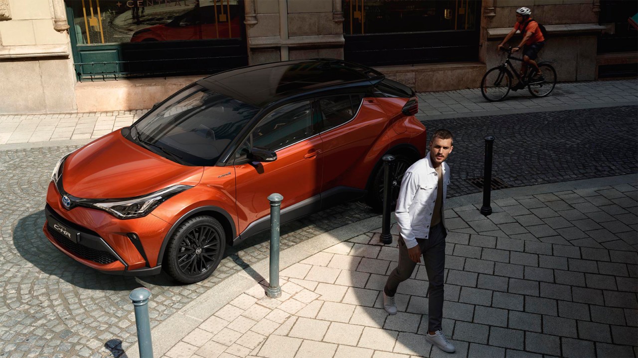 Model shown is Hybrid C-UERO in bi-tone orange with black roof (2TC )	